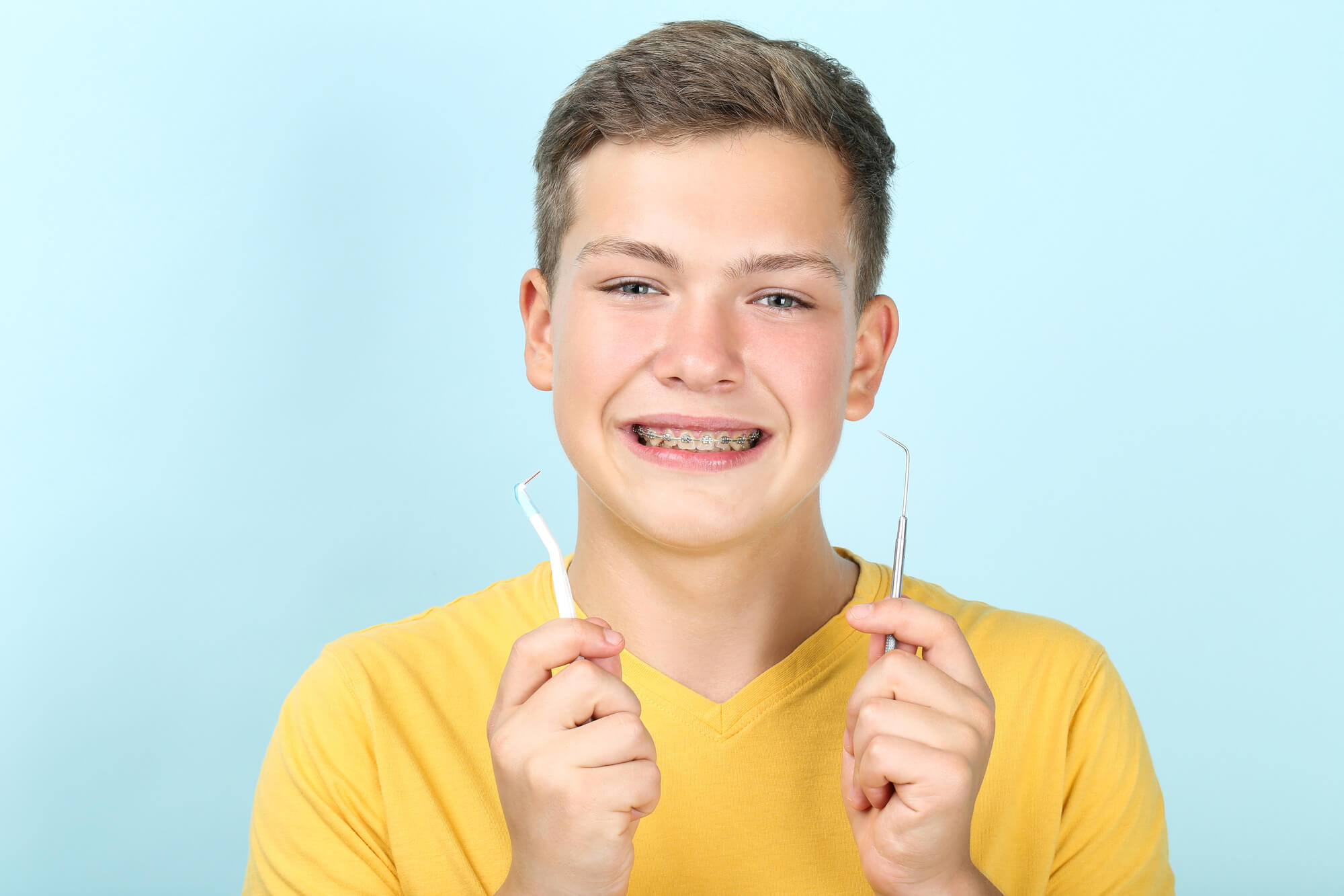 kid shows to periodontist in Plantation his dental tools