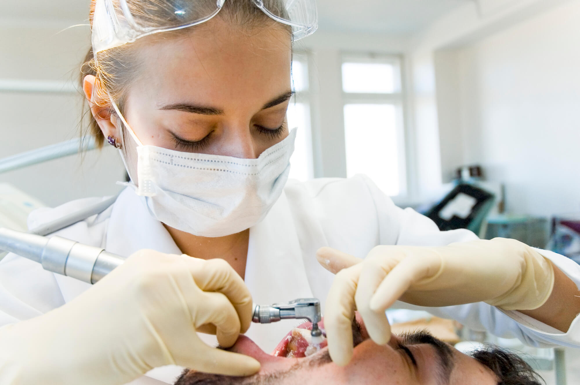 a dentist performing Sunrise Oral surgery 