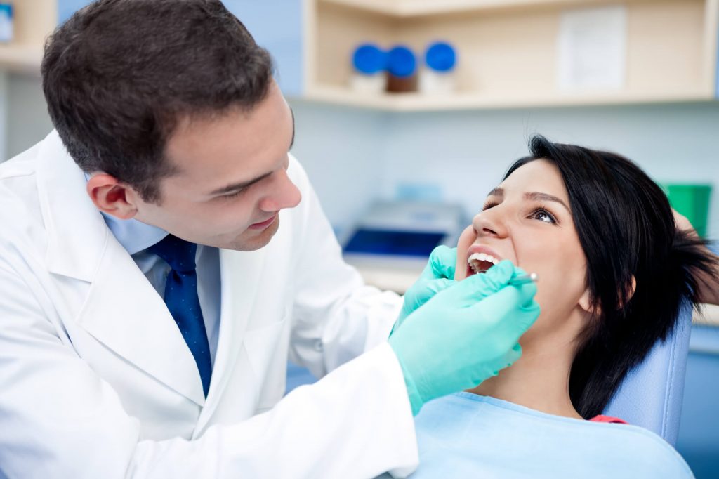 Dentist checking dental implants in patient plantation 